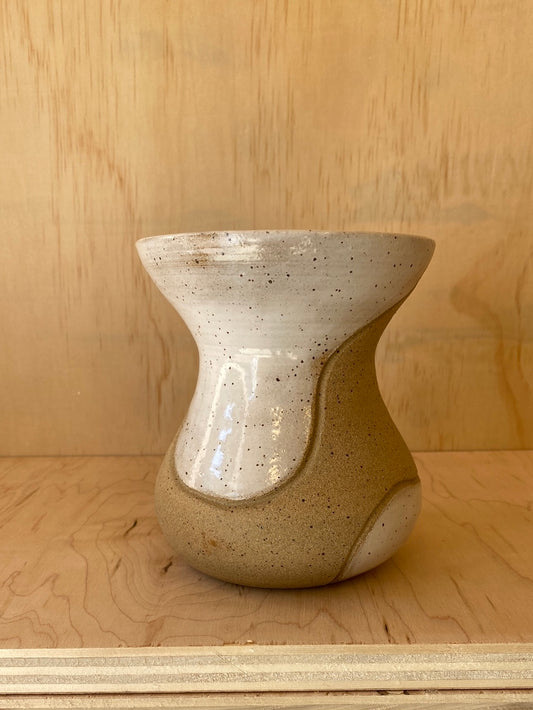 Sand and white vase